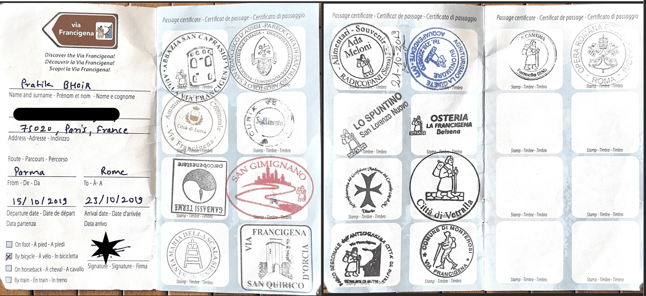 Open Via Francigena pilgrim credential filled with stamps collected along the route from Parma to Rome.